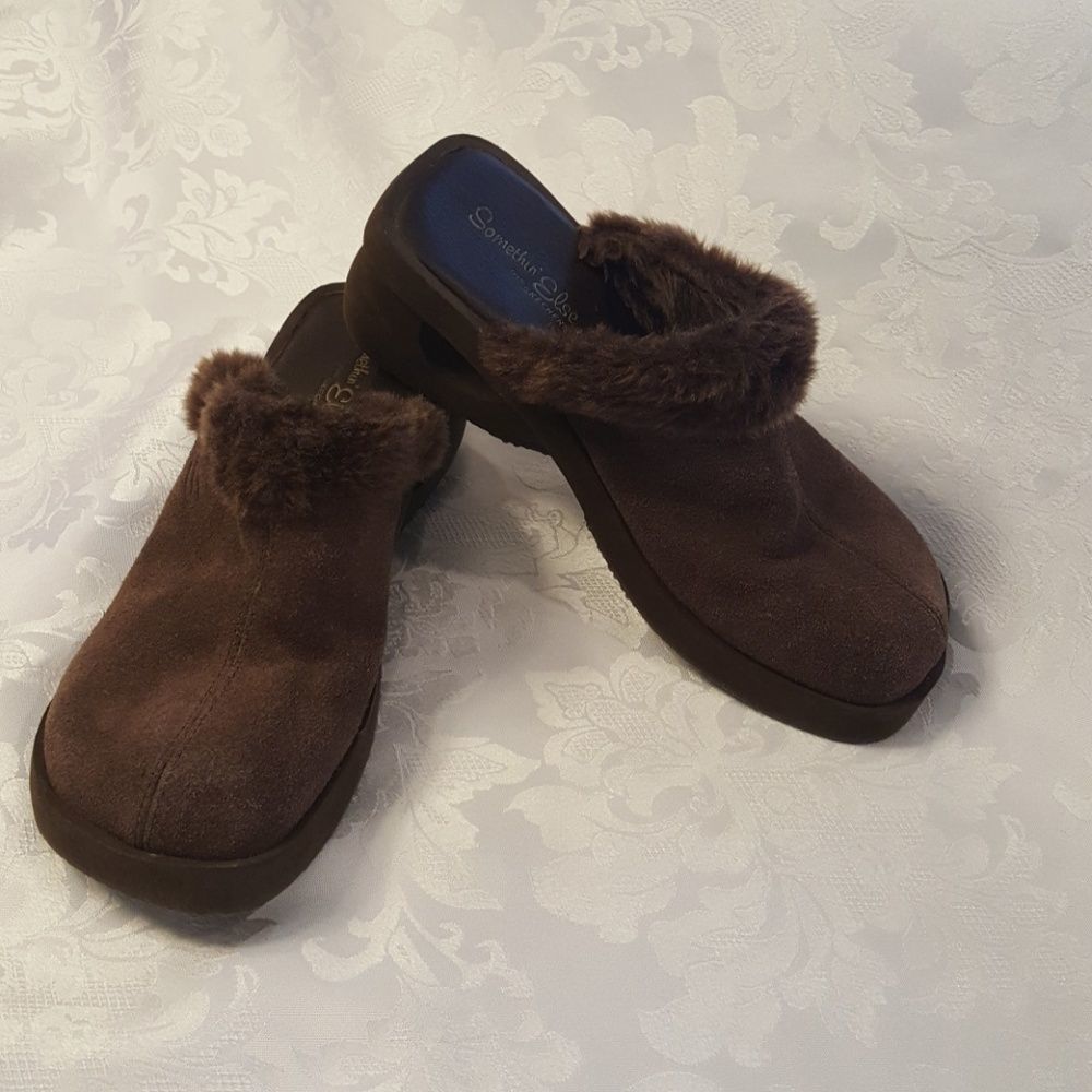 Brown Skechers slides